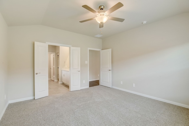 506 Stagg St, Mckinney, TX 75069 - unfurnished bedroom featuring light colored carpet, vaulted ceiling, baseboards, ceiling fan, and ensuite bathroom