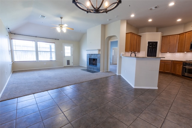 4356 Mountain Crest Dr, Fort Worth, TX 76123 - kitchen featuring dark carpet, dark tile patterned floors, lofted ceiling, open floor plan, and a ceiling fan