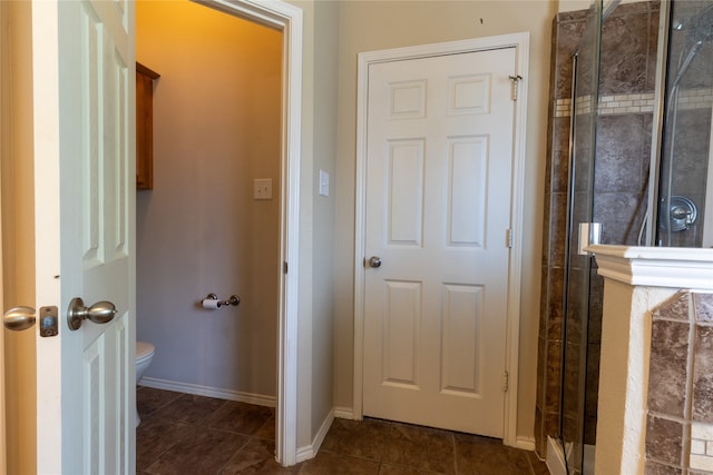 4356 Mountain Crest Dr, Fort Worth, TX 76123 - bathroom featuring a stall shower, tile patterned flooring, toilet, and baseboards