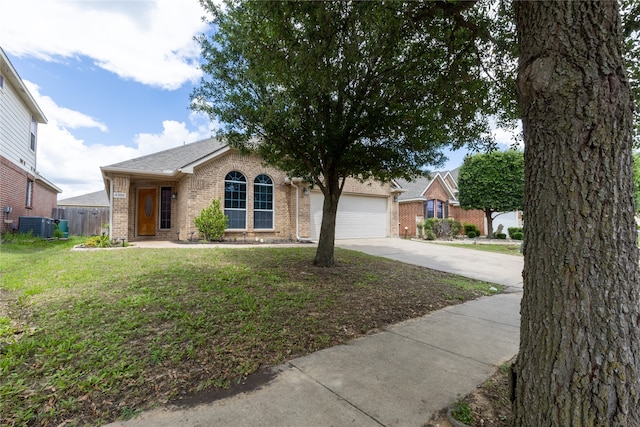 4356 Mountain Crest Dr, Fort Worth, TX 76123 - view of front of home with driveway, brick siding, an attached garage, and central AC unit