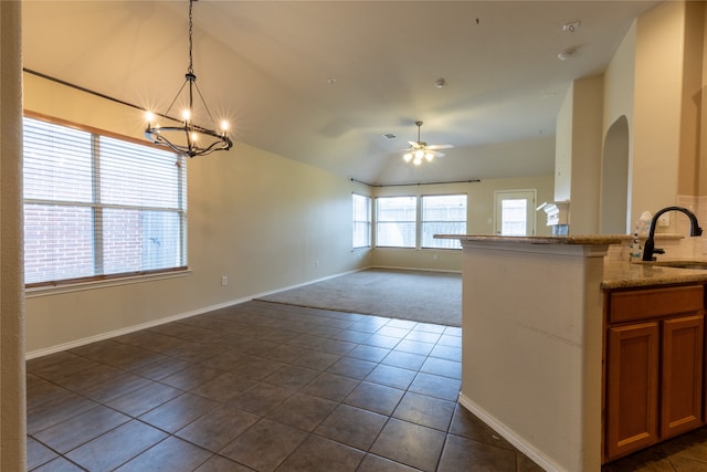 4356 Mountain Crest Dr, Fort Worth, TX 76123 - kitchen featuring a sink, open floor plan, a chandelier, dark carpet, and dark tile patterned flooring