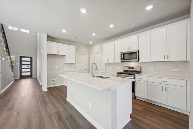 518 Willet Dr, Mckinney, TX 75069 - kitchen featuring stainless steel appliances, a sink, backsplash, white cabinetry, and dark wood-style floors