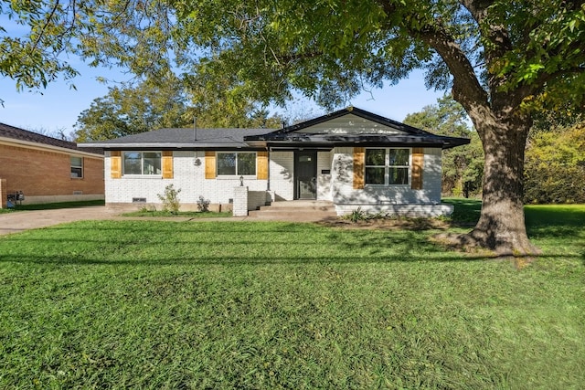 single story home featuring a front yard, brick siding, and crawl space