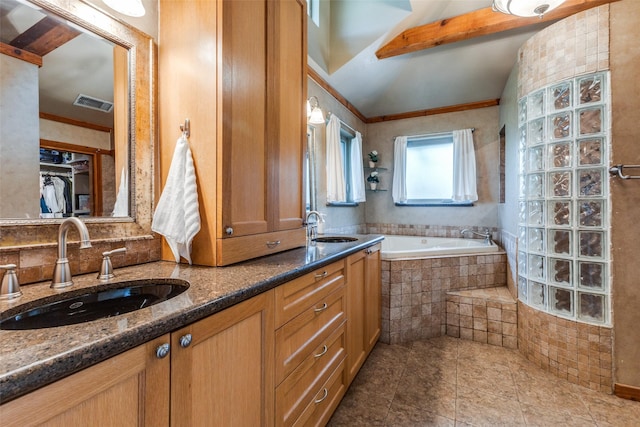 full bathroom with tile patterned flooring, a bath, and double vanity