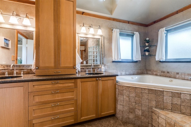 full bathroom with double vanity, a garden tub, tile patterned floors, and crown molding