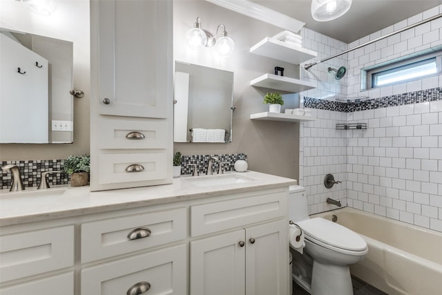bathroom with toilet, washtub / shower combination, backsplash, and double vanity