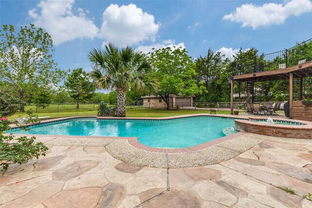 view of pool with a patio and a pool with connected hot tub