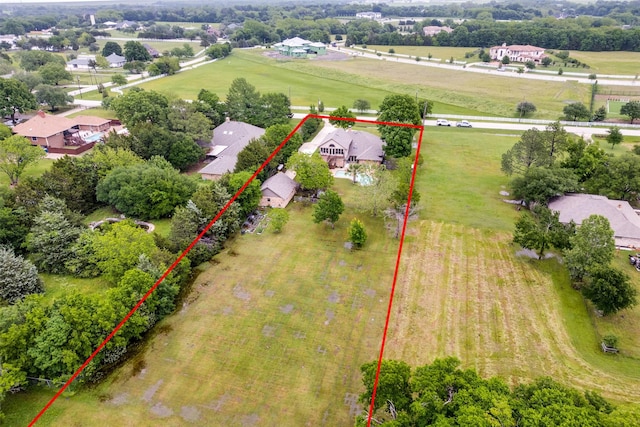 overview of rural landscape featuring property boundaries highlighted and nearby suburban area