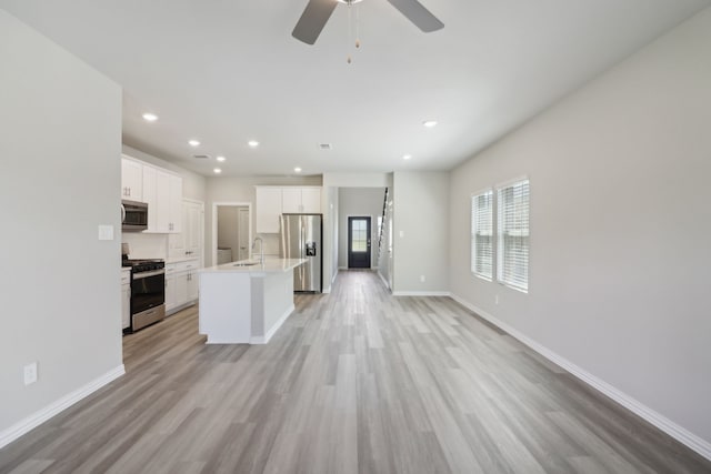 512 Willet Dr, Mckinney, TX 75069 - kitchen with appliances with stainless steel finishes, a sink, light wood-style flooring, baseboards, and recessed lighting