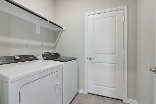 512 Willet Dr, Mckinney, TX 75069 - clothes washing area with washer and dryer, baseboards, and light tile patterned floors
