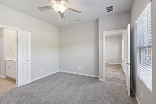 512 Willet Dr, Mckinney, TX 75069 - unfurnished bedroom featuring light colored carpet, baseboards, a ceiling fan, and connected bathroom