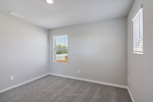 512 Willet Dr, Mckinney, TX 75069 - spare room with dark carpet, baseboards, and recessed lighting
