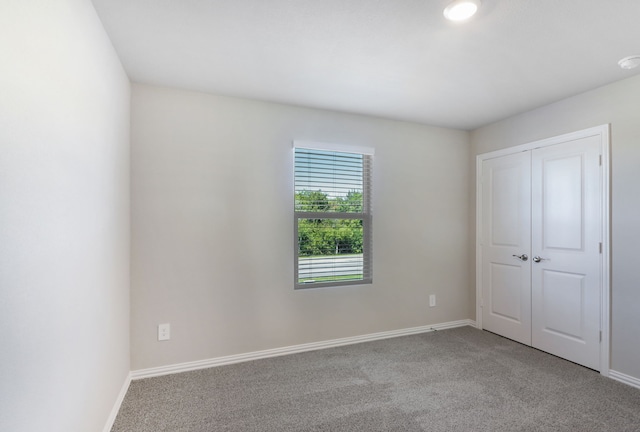 512 Willet Dr, Mckinney, TX 75069 - unfurnished bedroom with light colored carpet, baseboards, and a closet