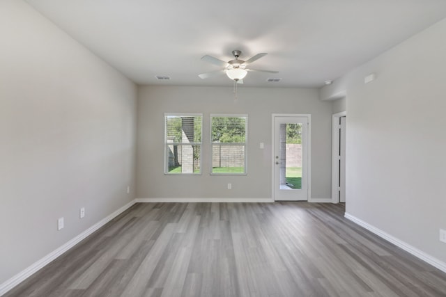 512 Willet Dr, Mckinney, TX 75069 - unfurnished room with wood finished floors, a ceiling fan, and baseboards