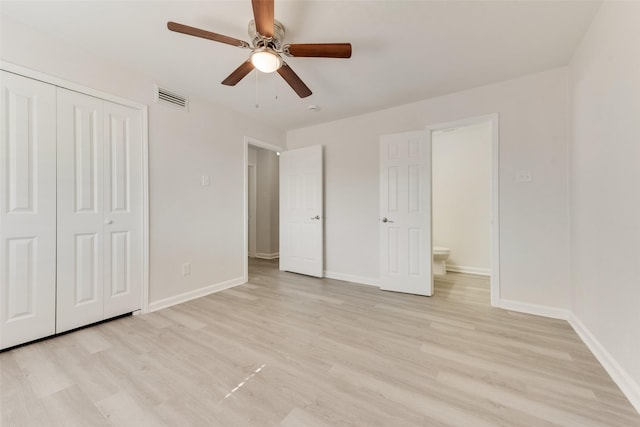 1112 Terrace Trl, Carrollton, TX 75006 - unfurnished bedroom featuring light wood finished floors, a closet, and baseboards