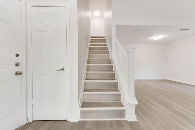 1112 Terrace Trl, Carrollton, TX 75006 - staircase with wood finished floors and baseboards