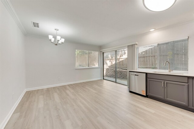 1112 Terrace Trl, Carrollton, TX 75006 - unfurnished dining area with crown molding, a sink, a chandelier, light wood-style floors, and baseboards