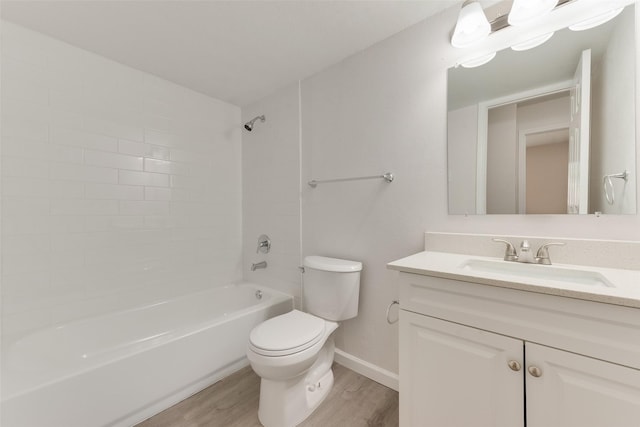 1112 Terrace Trl, Carrollton, TX 75006 - full bathroom with wood finished floors, toilet, vanity, bathtub / shower combination, and baseboards