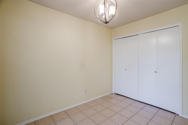 3209 Woodlark Dr, Fort Worth, TX 76123 - unfurnished bedroom featuring a chandelier, a closet, and baseboards