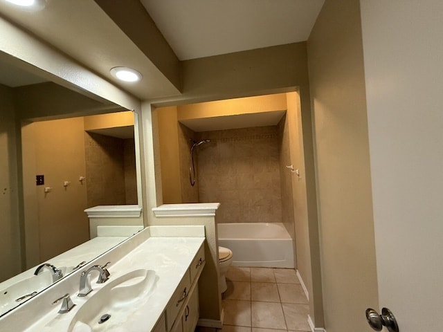 full bathroom with tile patterned floors, toilet, vanity, baseboards, and bathing tub / shower combination