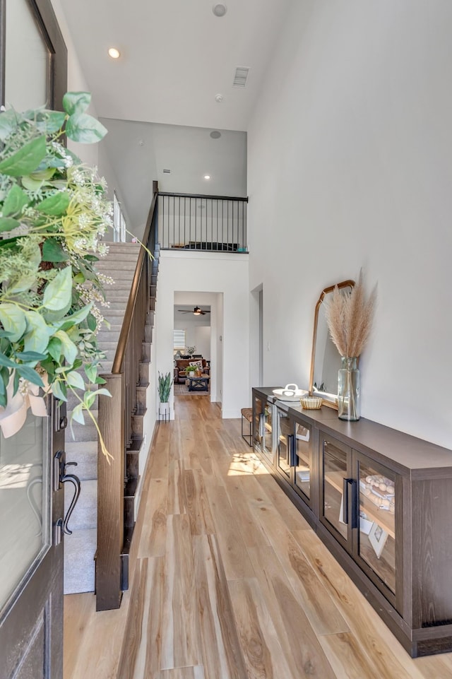 601 Wilderness Point Ln, Anna, TX 75409 - entrance foyer featuring wood finished floors, a high ceiling, recessed lighting, and stairs