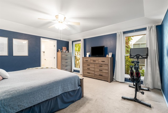 bedroom featuring multiple windows, carpet, and ceiling fan