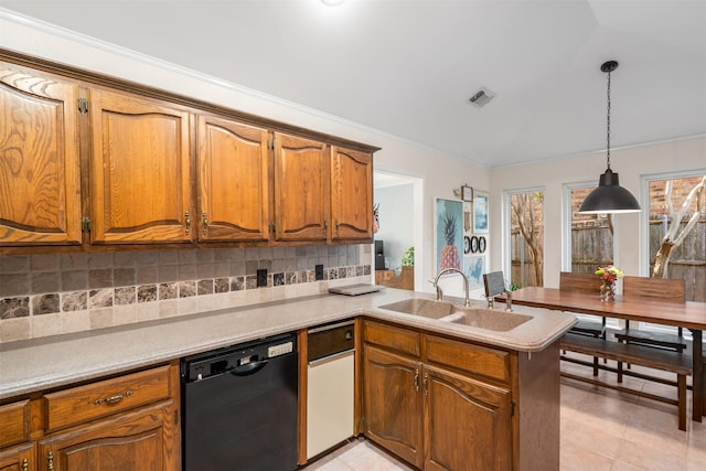 kitchen with dishwasher, a sink, a peninsula, decorative backsplash, and brown cabinets