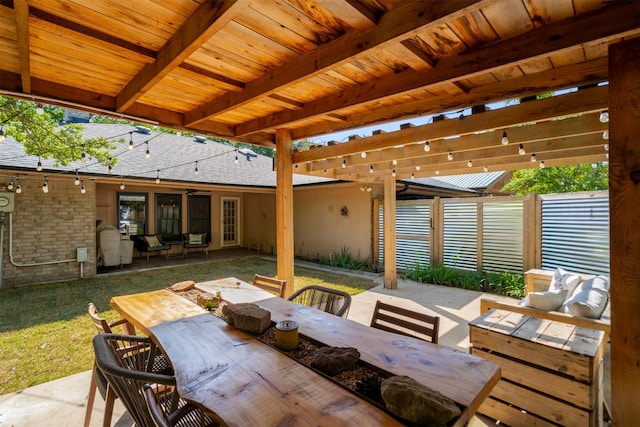 view of patio with outdoor dining area, outdoor lounge area, and fence