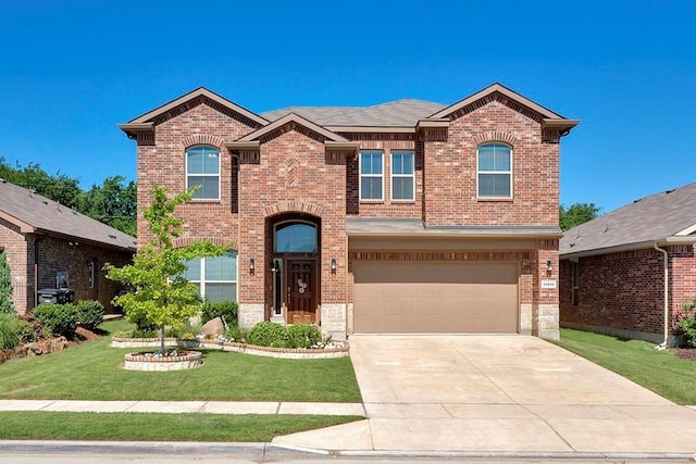 13013 Palancar Dr, Fort Worth, TX 76244 - view of front of property featuring brick siding, a front lawn, an attached garage, and driveway