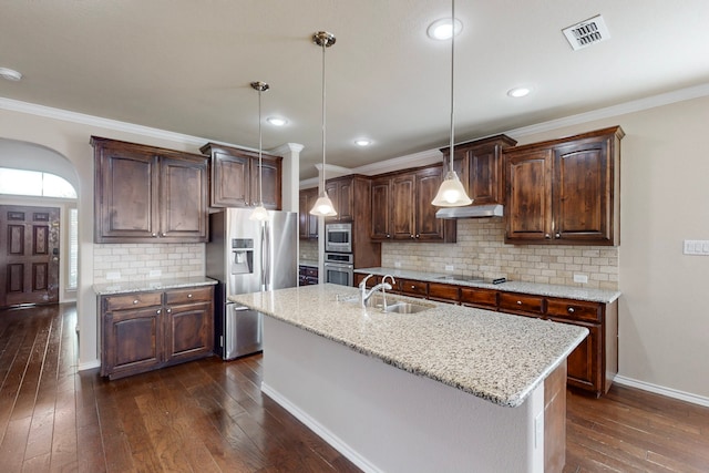 13013 Palancar Dr, Fort Worth, TX 76244 - kitchen featuring stainless steel appliances, a sink, dark wood-style flooring, baseboards, and dark brown cabinets