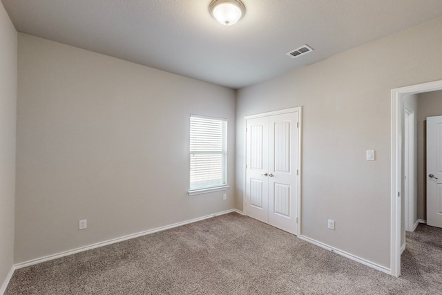 13013 Palancar Dr, Fort Worth, TX 76244 - unfurnished bedroom with carpet flooring, a closet, and baseboards