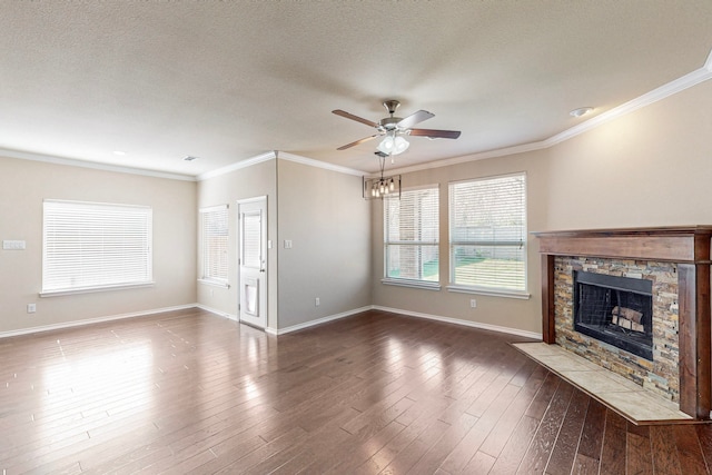 13013 Palancar Dr, Fort Worth, TX 76244 - unfurnished living room featuring a ceiling fan, baseboards, a fireplace, ornamental molding, and dark wood-style floors