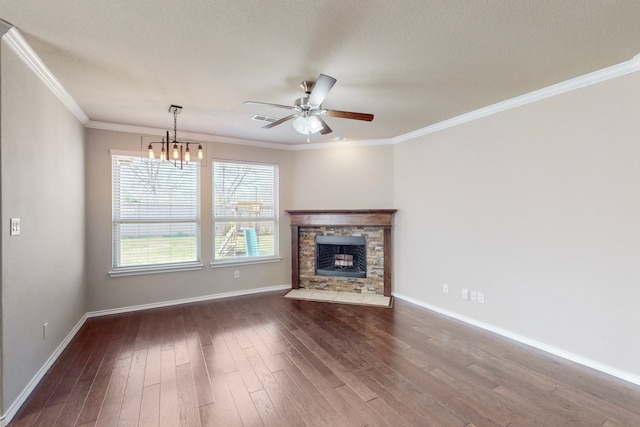 13013 Palancar Dr, Fort Worth, TX 76244 - unfurnished living room featuring ceiling fan, dark wood-style flooring, a chandelier, baseboards, and a fireplace