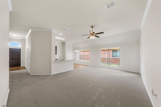 425 Tobin Dr, Seagoville, TX 75159 - unfurnished living room featuring light colored carpet, baseboards, ornamental molding, a ceiling fan, and a sink
