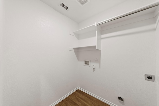 425 Tobin Dr, Seagoville, TX 75159 - laundry area with hookup for a gas dryer, baseboards, electric dryer hookup, dark wood finished floors, and hookup for a washing machine