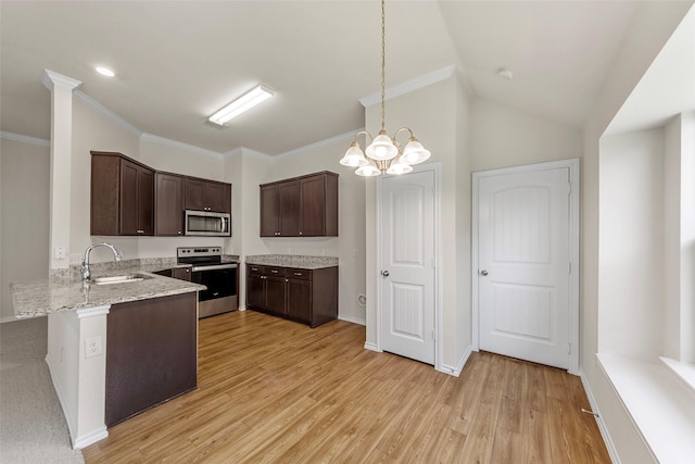 425 Tobin Dr, Seagoville, TX 75159 - kitchen with stainless steel appliances, a sink, dark brown cabinetry, light wood finished floors, and light stone countertops