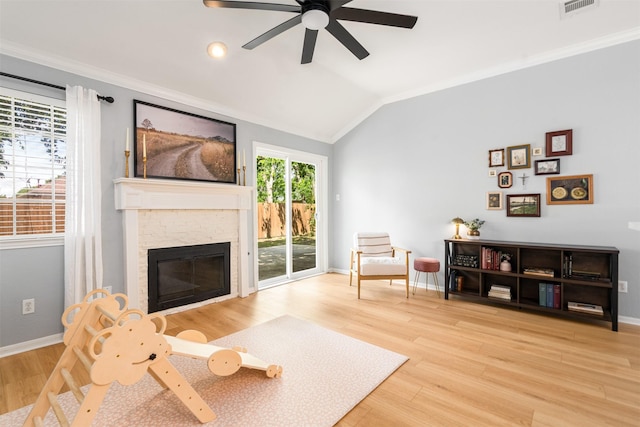 2038 Frontier Trl, Lewisville, TX 75067 - living area with a ceiling fan, crown molding, wood finished floors, lofted ceiling, and baseboards
