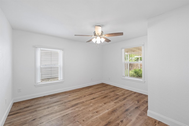 1720 Bagby Ave, Waco, TX 76706 - spare room with a ceiling fan, wood finished floors, and baseboards