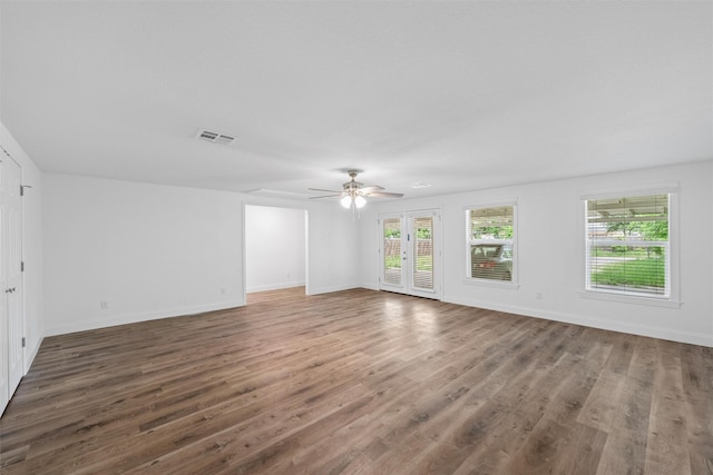 1720 Bagby Ave, Waco, TX 76706 - spare room featuring wood finished floors, ceiling fan, and baseboards