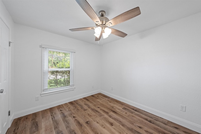 1720 Bagby Ave, Waco, TX 76706 - spare room featuring wood finished floors, baseboards, and a ceiling fan