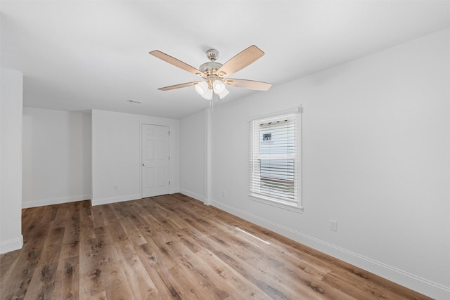 1720 Bagby Ave, Waco, TX 76706 - empty room with light wood-style floors, baseboards, and a ceiling fan