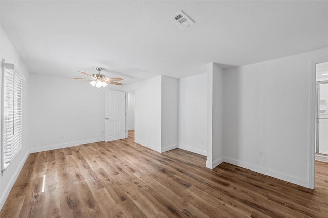 1720 Bagby Ave, Waco, TX 76706 - spare room with wood finished floors, ceiling fan, healthy amount of natural light, and baseboards