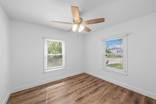 1720 Bagby Ave, Waco, TX 76706 - unfurnished room with plenty of natural light, baseboards, and wood finished floors