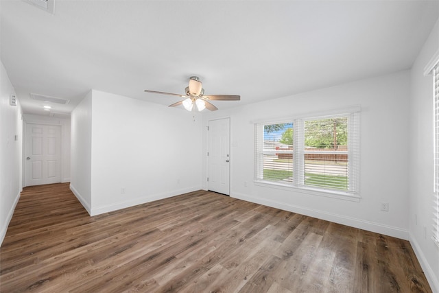 1720 Bagby Ave, Waco, TX 76706 - unfurnished room featuring wood finished floors, baseboards, and a ceiling fan
