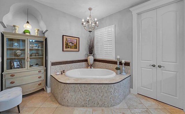 8416 Spicewood Springs Rd, Waco, TX 76633 - full bathroom with a chandelier, a garden tub, and tile patterned flooring