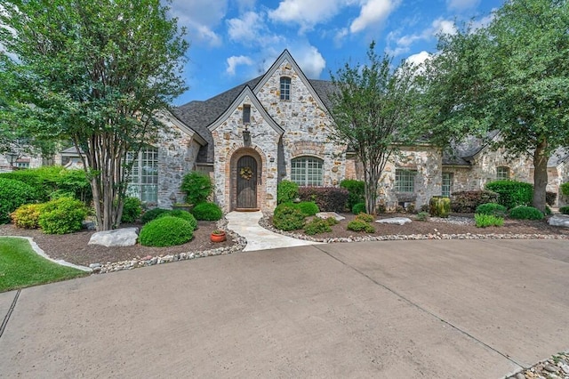 8416 Spicewood Springs Rd, Waco, TX 76633 - french country style house featuring stone siding