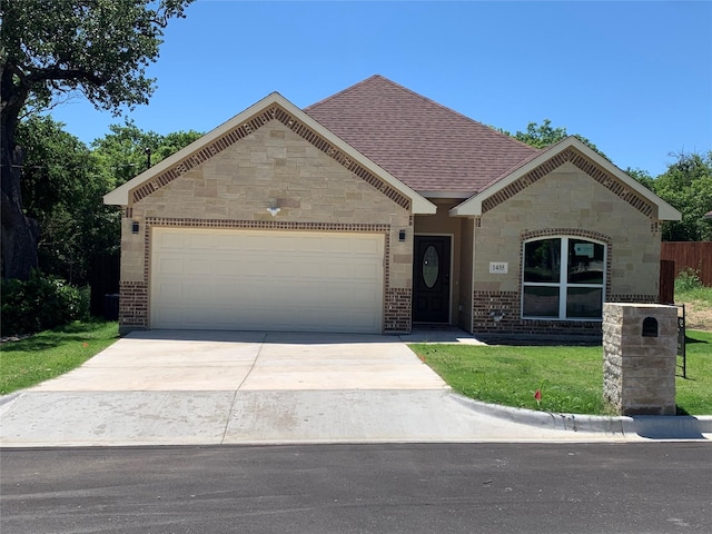 1435 Vine St, Weatherford, TX 76086 - view of front of property featuring concrete driveway, a garage, stone siding, and brick siding