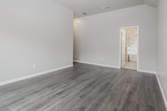 1435 Vine St, Weatherford, TX 76086 - empty room with wood finished floors and lofted ceiling