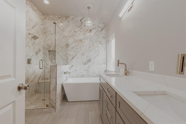 1435 Vine St, Weatherford, TX 76086 - bathroom with a soaking tub, a marble finish shower, double vanity, and tile walls