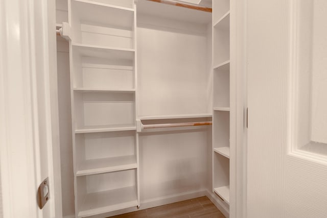 1435 Vine St, Weatherford, TX 76086 - walk in closet featuring wood finished floors